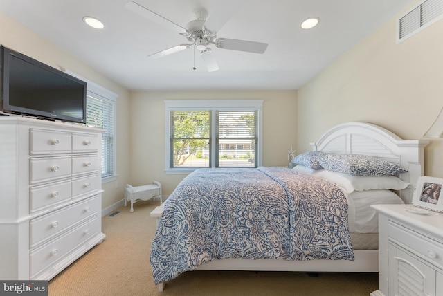 bedroom with light carpet and ceiling fan