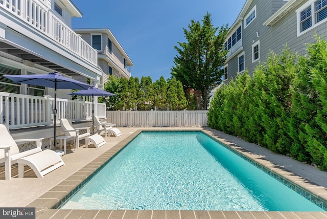 view of swimming pool with a patio area