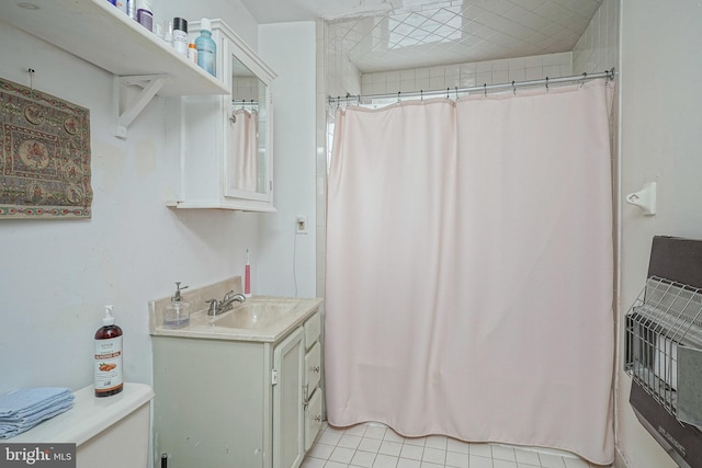 bathroom with vanity and tile patterned floors