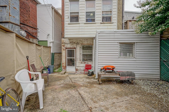 back of property featuring a patio