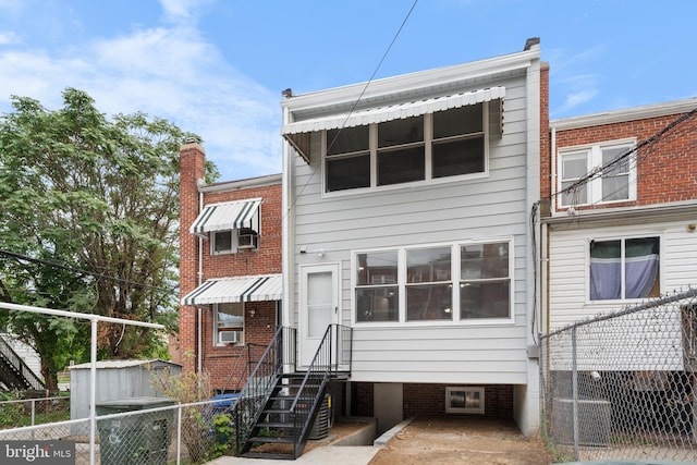 back of property featuring cooling unit