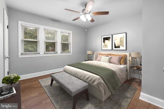 bedroom with dark hardwood / wood-style flooring and ceiling fan