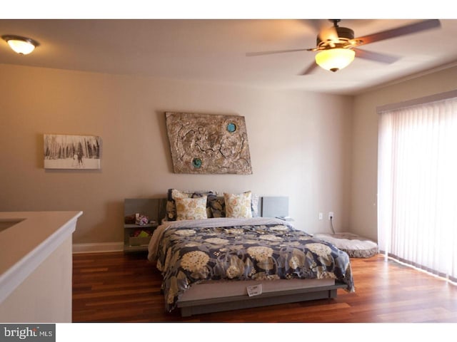 bedroom with ceiling fan and wood-type flooring