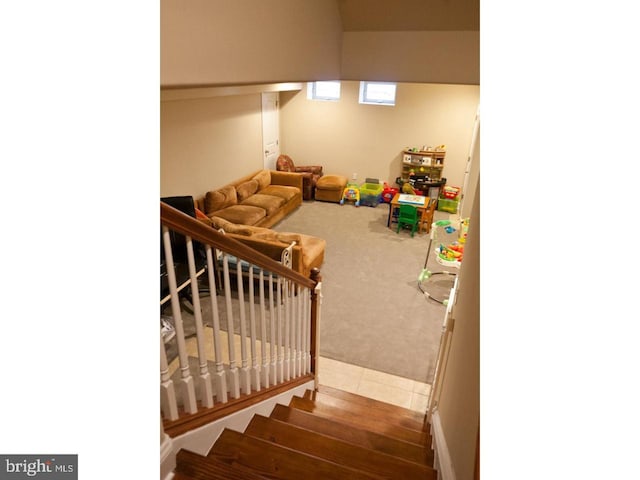 stairway featuring tile patterned flooring