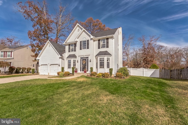 638 Mills Ln, Williamstown, NJ 08094 - traditional home with concrete driveway, a chimney, and an attached garage