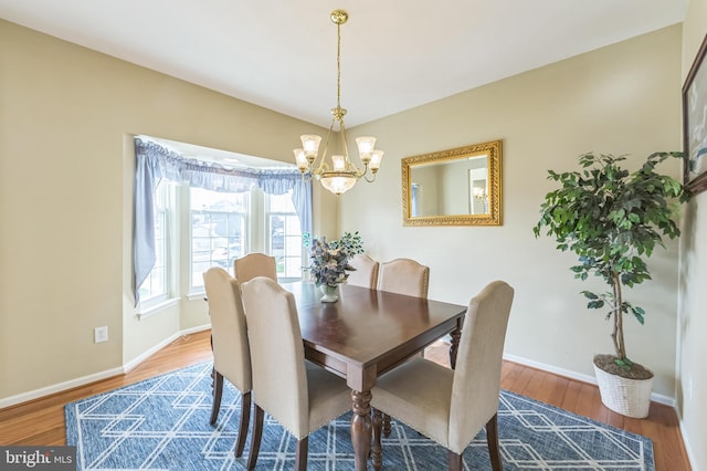 638 Mills Ln, Williamstown, NJ 08094 - dining space featuring a chandelier, wood finished floors, and baseboards