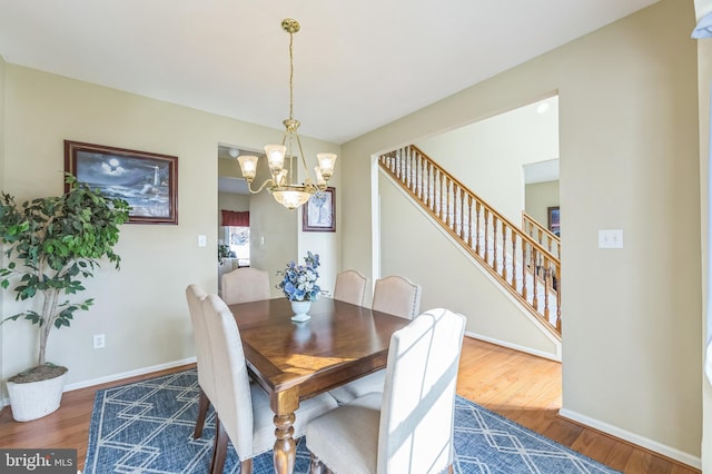 638 Mills Ln, Williamstown, NJ 08094 - dining area with a chandelier, wood finished floors, baseboards, and stairway