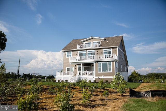 view of front of home with a balcony and a porch