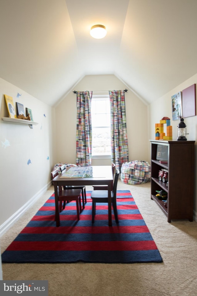 playroom featuring lofted ceiling and light colored carpet