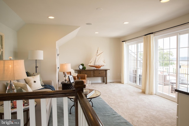 carpeted bedroom featuring lofted ceiling and access to outside