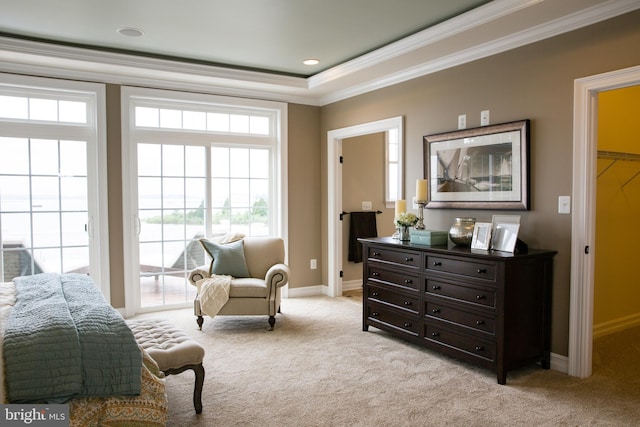 sitting room with crown molding and light carpet