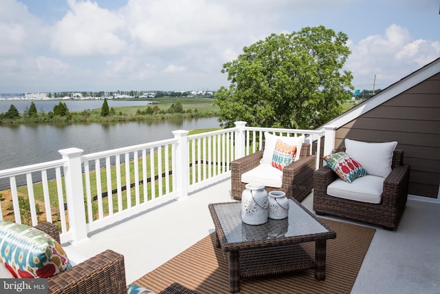 balcony featuring a deck with water view