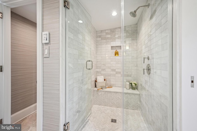 bathroom with tile patterned flooring and a shower with shower door