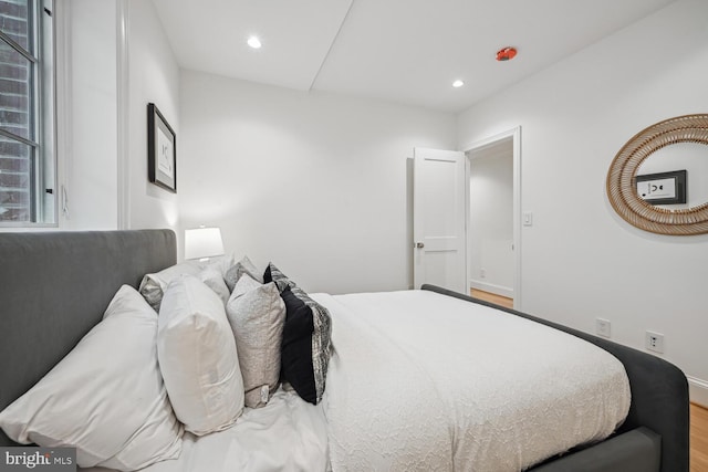 bedroom featuring wood-type flooring