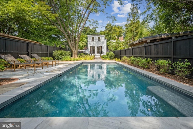 view of swimming pool with a patio