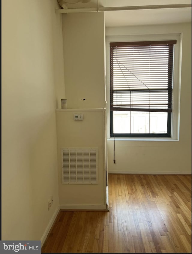 unfurnished room with light hardwood / wood-style flooring