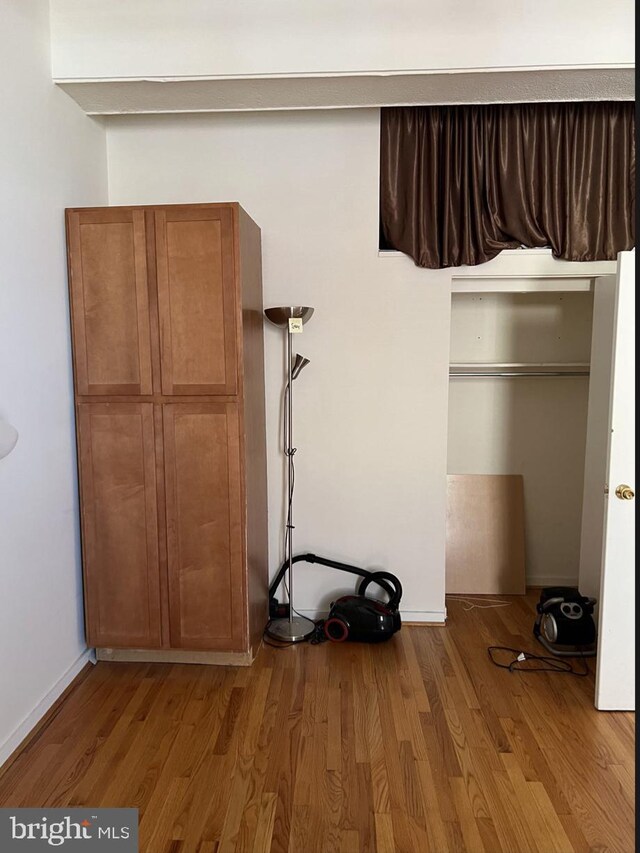 interior space featuring a closet and hardwood / wood-style flooring