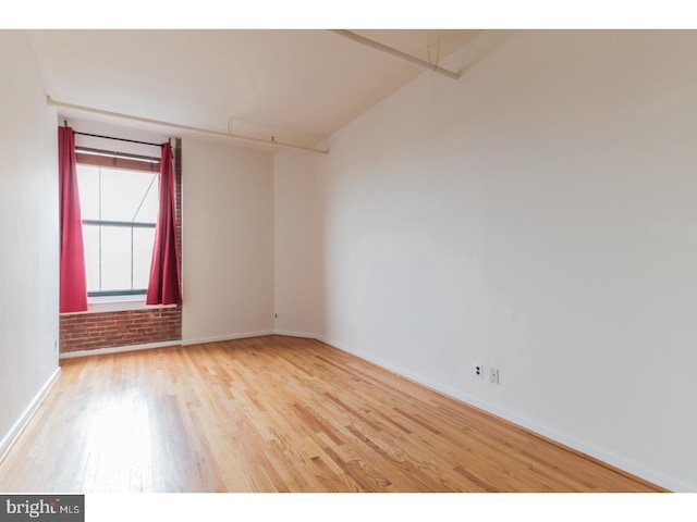 spare room featuring light hardwood / wood-style floors