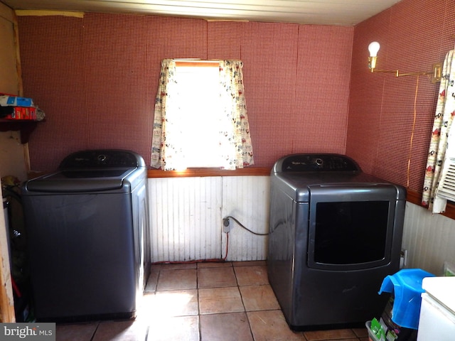 laundry room featuring separate washer and dryer and tile patterned flooring