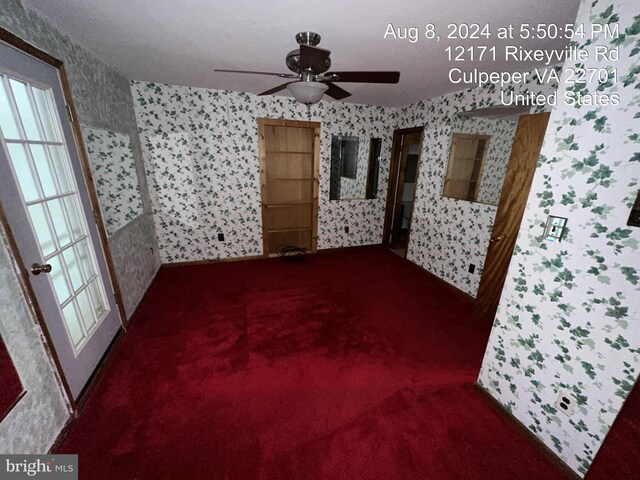 unfurnished room featuring carpet and ceiling fan