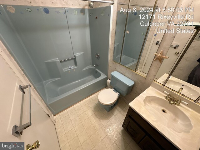 full bathroom with toilet, vanity, and bathtub / shower combination