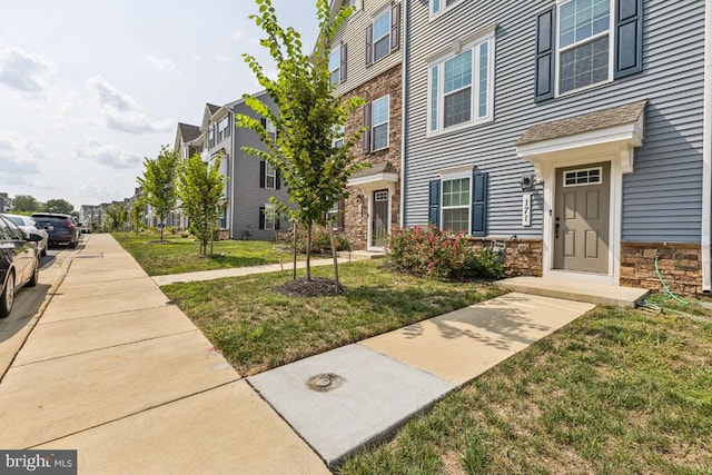 view of community featuring a lawn