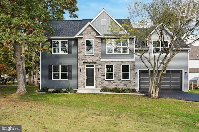 view of front of property featuring a garage and a front yard