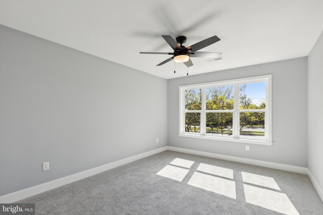 carpeted empty room with ceiling fan