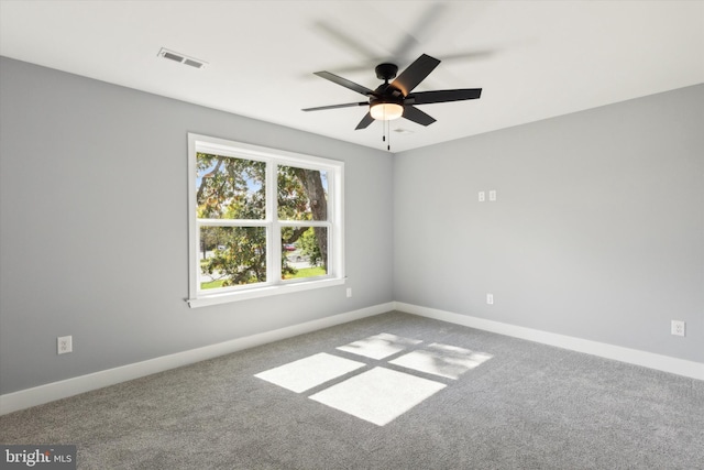 spare room with carpet flooring and ceiling fan