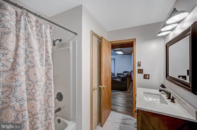 bathroom with shower / bath combination with curtain, vanity, and hardwood / wood-style floors