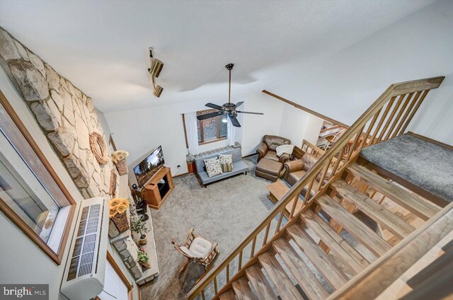 living room featuring ceiling fan and carpet flooring