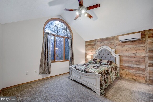 bedroom featuring ceiling fan, wood walls, carpet floors, lofted ceiling, and a wall mounted air conditioner