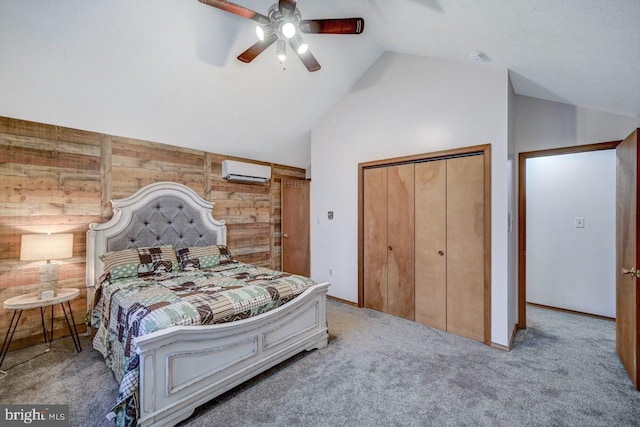 bedroom with wood walls, a wall mounted air conditioner, carpet flooring, ceiling fan, and a closet