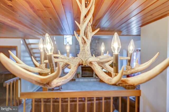 dining area with wooden ceiling, wood-type flooring, a notable chandelier, and baseboard heating