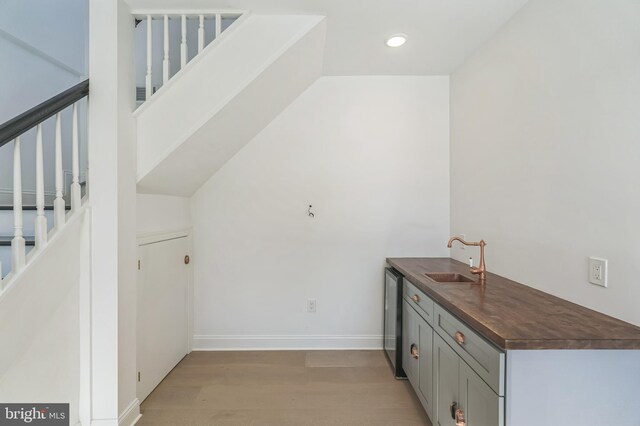 interior space with sink and light hardwood / wood-style flooring