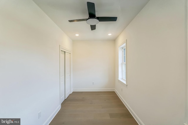 spare room featuring light wood-type flooring and ceiling fan