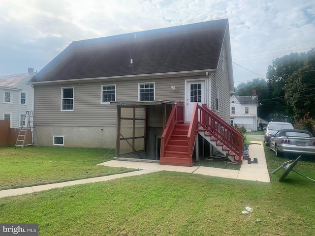 rear view of house with a lawn