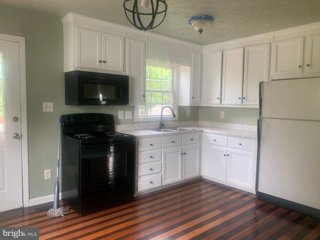 kitchen featuring white cabinetry, sink, a textured ceiling, and black appliances