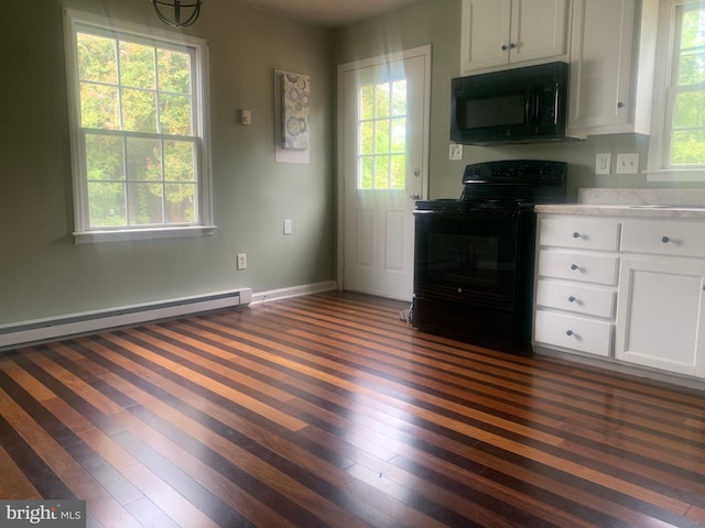 kitchen featuring a healthy amount of sunlight, dark hardwood / wood-style floors, white cabinets, and black appliances