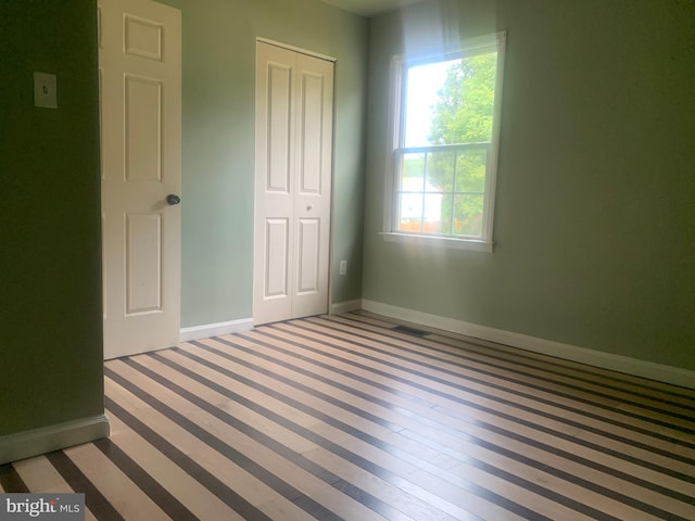 unfurnished bedroom featuring a closet