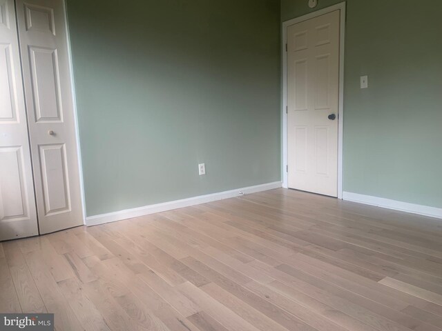 spare room with light wood-type flooring