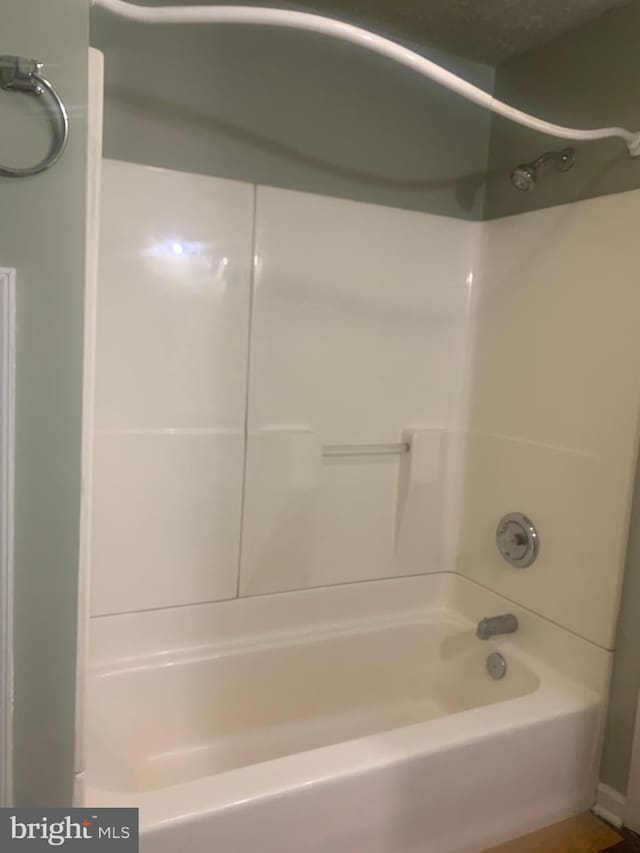 bathroom with shower / bathtub combination