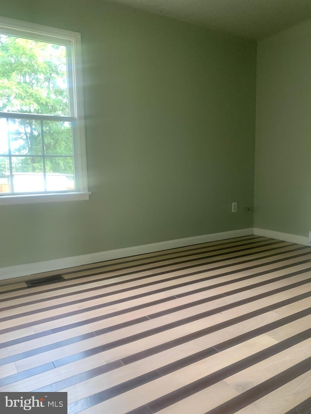 spare room featuring a wealth of natural light