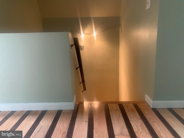 stairway with wood-type flooring