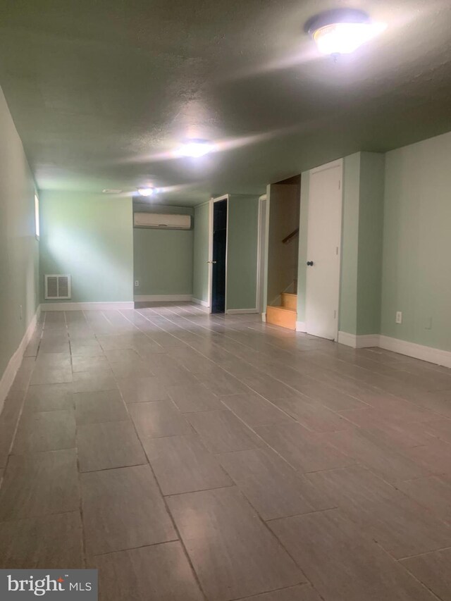 spare room with light wood-type flooring and a baseboard radiator