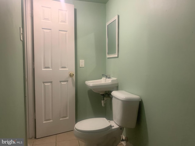 bathroom featuring tile patterned flooring, sink, and toilet