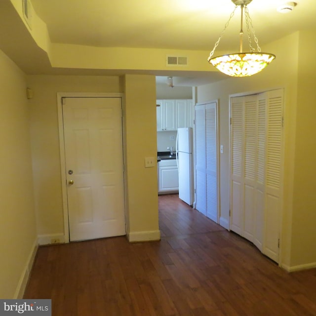 interior space with sink and dark hardwood / wood-style flooring