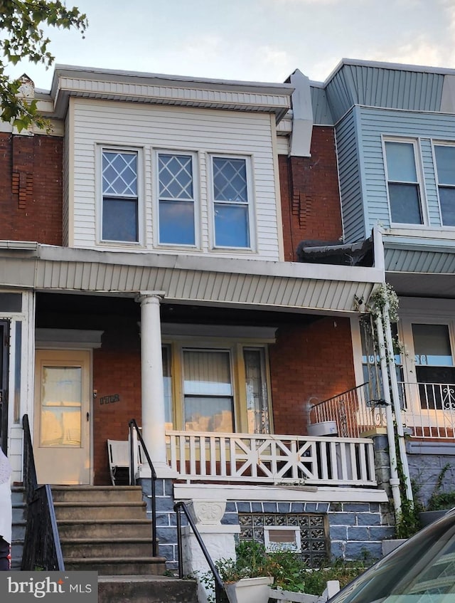 view of property with a porch