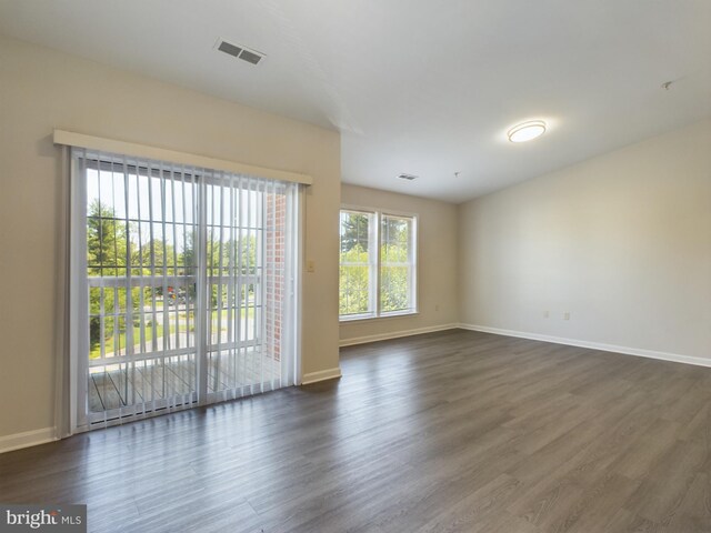 empty room featuring dark wood-type flooring