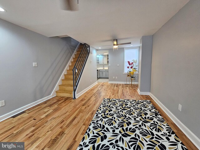 unfurnished room featuring hardwood / wood-style flooring and ceiling fan